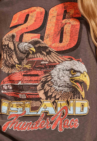 Close-up of a dark brown graphic t-shirt featuring a distressed orange '26' and a large bald eagle over a red muscle car, with 'ISLAND Thunder Race' printed below.